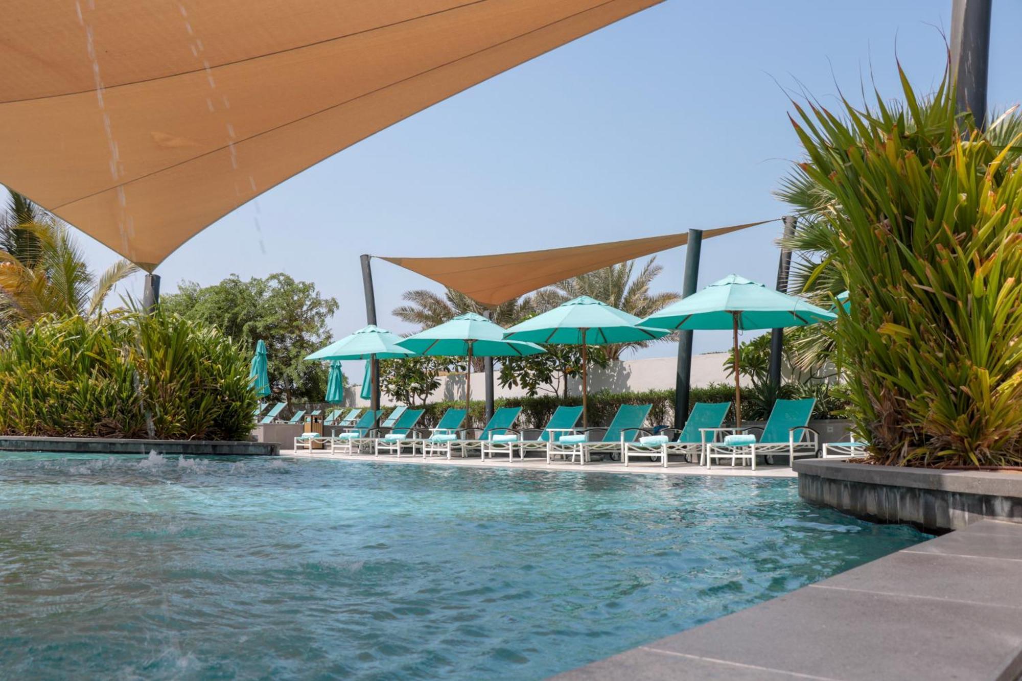 Bay La Sun Hotel And Marina - Emaar King Abdullah Economic City Buitenkant foto The swimming pool at the hotel